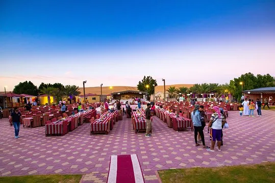 Visitors participating in traditional Bedouin activities at a desert safari without dune bashing